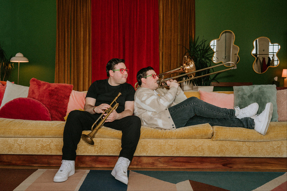 Ez and Dee, better known as the Potash Twins, are world-class musicians, TV hosts, and unapologetic candy fanatics. When they're not jamming with music legends or filming food-filled adventures, they're deep in candy R&D (Research & Devouring), inventing gummies that slap harder than a tuba solo.